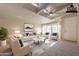 Virtually staged living room with vaulted ceilings and bay window at 3301 S Goldfield Rd # 2015, Apache Junction, AZ 85119