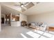 Open living room with vaulted ceilings and kitchen view at 3301 S Goldfield Rd # 2015, Apache Junction, AZ 85119