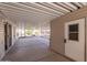 Covered patio with screened enclosure and concrete flooring at 3301 S Goldfield Rd # 2015, Apache Junction, AZ 85119