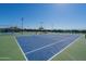 Enjoy a game of tennis on this well-lit court at 3301 S Goldfield Rd # 2015, Apache Junction, AZ 85119
