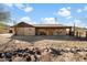 Ranch style home with covered porch and desert landscaping at 3537 W Meander Rd, New River, AZ 85087