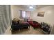 Comfortable bedroom with two twin beds and ample closet space at 3818 W Rose Ln, Phoenix, AZ 85019