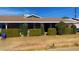 Brick ranch home with carport and well-manicured hedges at 3818 W Rose Ln, Phoenix, AZ 85019