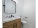 Modern bathroom with white countertop vanity and a frameless mirror at 4127 E Cambridge Ave, Phoenix, AZ 85008