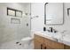 Bathroom with marble vanity, walk-in shower, and modern fixtures at 4127 E Cambridge Ave, Phoenix, AZ 85008