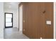 Modern entryway with wood slat wall and glass door at 4127 E Cambridge Ave, Phoenix, AZ 85008