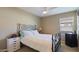 Bedroom with a white dresser and wrought iron bed at 5653 E Athena Rd, Florence, AZ 85132