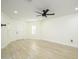 Bright living room with wood-look floors and ceiling fan at 6013 S 12Th Pl, Phoenix, AZ 85042