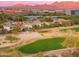 Home situated on a golf course near mountains at 6857 E Montreal Pl, Scottsdale, AZ 85254