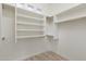 Bright walk-in closet with shelves and hanging rods at 6857 E Montreal Pl, Scottsdale, AZ 85254