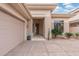 Front entryway with garage and desert landscaping at 6857 E Montreal Pl, Scottsdale, AZ 85254