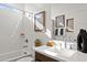 Modern bathroom with single vanity and shower/tub combo at 7431 W Whitehorn Trl, Peoria, AZ 85383