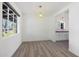 Bright dining room features light wood floors and a view to the backyard at 1010 W Oregon Ave, Phoenix, AZ 85013