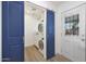 Laundry room with blue barn doors and backyard access at 1010 W Oregon Ave, Phoenix, AZ 85013