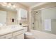 Clean bathroom, bathtub, shower, and vanity at 13019 W Rampart Dr, Sun City West, AZ 85375