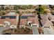 Aerial view of house with solar panels and neighborhood at 16532 W Monte Vista Rd, Goodyear, AZ 85395