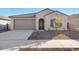 Single-story home with a two-car garage and landscaped front yard at 17837 W Encinas Ln, Goodyear, AZ 85338