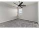 Bedroom with ceiling fan and window at 18056 W Wolf St, Goodyear, AZ 85395