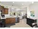 Spacious kitchen featuring granite countertops and dark wood cabinets at 20028 N Coronado Ridge Dr, Surprise, AZ 85387