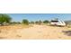 Large lot with a travel trailer and fencing at 20165 W Moccasin Trl, Buckeye, AZ 85326