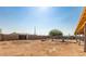 Large backyard with a swimming pool and a covered patio at 20165 W Moccasin Trl, Buckeye, AZ 85326