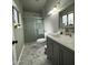 Updated bathroom with gray vanity and marble floors at 20165 W Moccasin Trl, Buckeye, AZ 85326