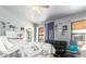 Bright bedroom with comfy bed, couch, and window at 20165 W Moccasin Trl, Buckeye, AZ 85326