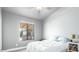 Bright bedroom with a large window and plush bedding at 20165 W Moccasin Trl, Buckeye, AZ 85326