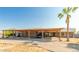 House exterior with covered parking and landscaping at 20165 W Moccasin Trl, Buckeye, AZ 85326
