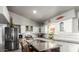 Modern kitchen features granite countertops and stainless steel appliances at 20165 W Moccasin Trl, Buckeye, AZ 85326