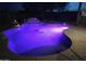 Inviting pool with purple night lighting at 20165 W Moccasin Trl, Buckeye, AZ 85326