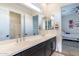 Double vanity bathroom with modern fixtures and a walk-in shower at 20698 E Marsh Rd, Queen Creek, AZ 85142