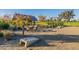 Community gathering space with cornhole and picnic tables at 20698 E Marsh Rd, Queen Creek, AZ 85142