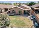 Backyard view with grass, patio furniture, and trees at 22 E Mill Reef Dr, San Tan Valley, AZ 85143