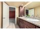 Double sink bathroom with granite countertop and view of bedroom at 2221 E Northview Ave, Phoenix, AZ 85020