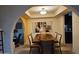 Elegant dining room with a large wood table and statement artwork at 2221 E Northview Ave, Phoenix, AZ 85020