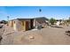 Gravel backyard with storage shed and AC unit at 2261 N Demaret Dr, Mesa, AZ 85215