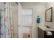 Bathroom with a bathtub and vanity with view of bedroom at 2261 N Demaret Dr, Mesa, AZ 85215