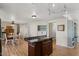 Bright dining area with wood flooring and view into kitchen at 2261 N Demaret Dr, Mesa, AZ 85215