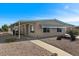 Tan single-story home with covered carport and walkway at 2261 N Demaret Dr, Mesa, AZ 85215