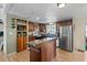 Modern kitchen with stainless steel appliances and island at 2261 N Demaret Dr, Mesa, AZ 85215