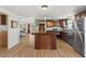Updated kitchen featuring stainless steel appliances and an island at 2261 N Demaret Dr, Mesa, AZ 85215