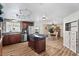 Modern kitchen with stainless steel appliances and an island at 2261 N Demaret Dr, Mesa, AZ 85215