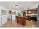 Eat-in kitchen with stainless steel appliances and ample cabinet space at 2261 N Demaret Dr, Mesa, AZ 85215