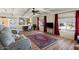 Spacious living room with hardwood floors and a ceiling fan at 2261 N Demaret Dr, Mesa, AZ 85215