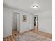 Spacious living area with wood floors and access to other rooms at 2261 N Demaret Dr, Mesa, AZ 85215