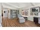 Living room with hardwood floors, built in shelving and comfortable seating at 2261 N Demaret Dr, Mesa, AZ 85215