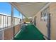 Covered patio with seating area and artificial turf at 2261 N Demaret Dr, Mesa, AZ 85215