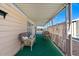Covered patio with wicker furniture and curtains at 2261 N Demaret Dr, Mesa, AZ 85215