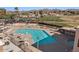 Community pool with ample seating and a hot tub at 2261 N Demaret Dr, Mesa, AZ 85215